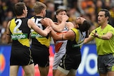 Toby Greene (third L) of the Giants and Alex Rance of the Tigers wrestle at the MCG.