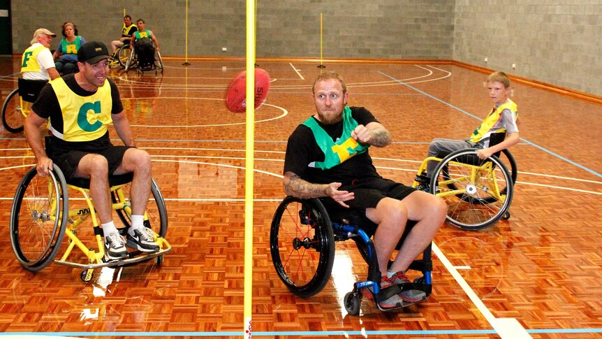 Richard Jones kicking a goal, wheelchair AFL style