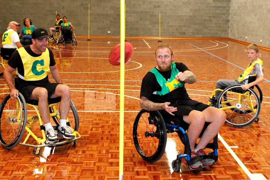 Richard Jones kicking a goal, wheelchair AFL style