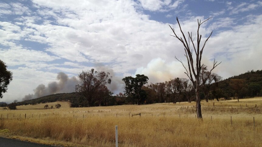 Black smoke pouring from near ignition point of Boorowa fire in New South Wales.