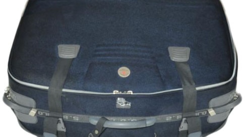 A picture of a large blue travel suitcase bearing the brand "SB Polo".