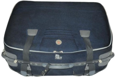 A picture of a large blue travel suitcase bearing the brand "SB Polo".