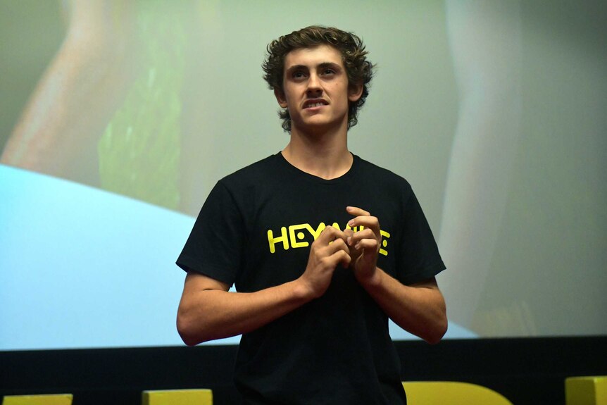 Timothy Martin on stage pitching idea at the 2020 Heywire Summit in Canberra