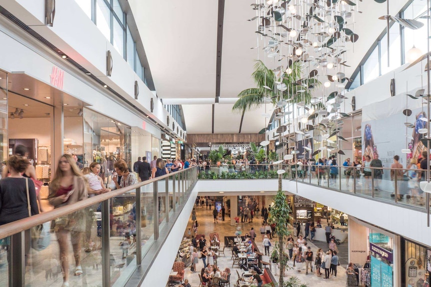 Shoppers walking around Westfield Chermside