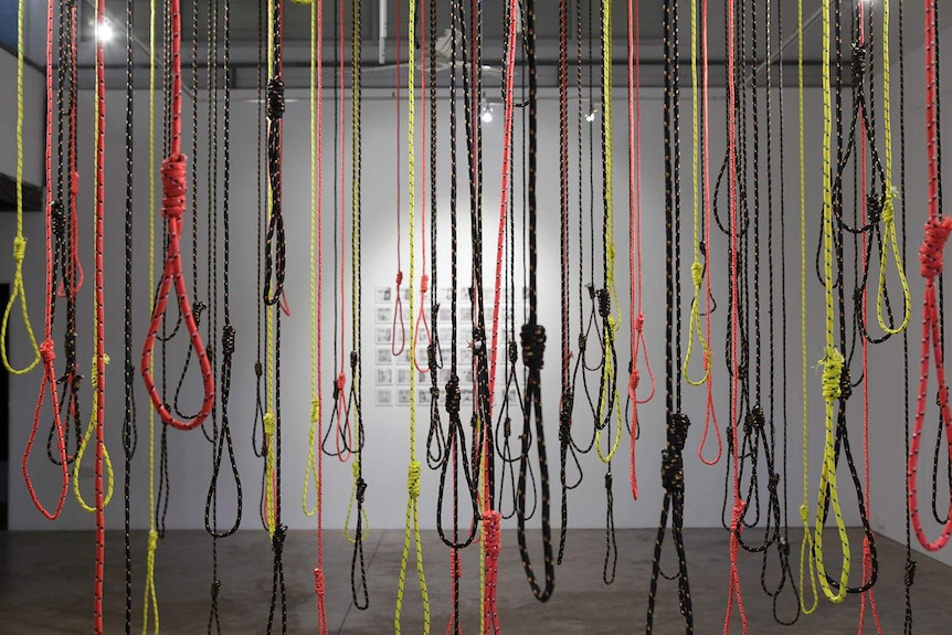 rope hangings in aboriginal flag colours