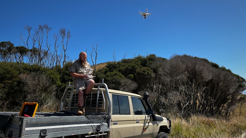 A man operating a drone.