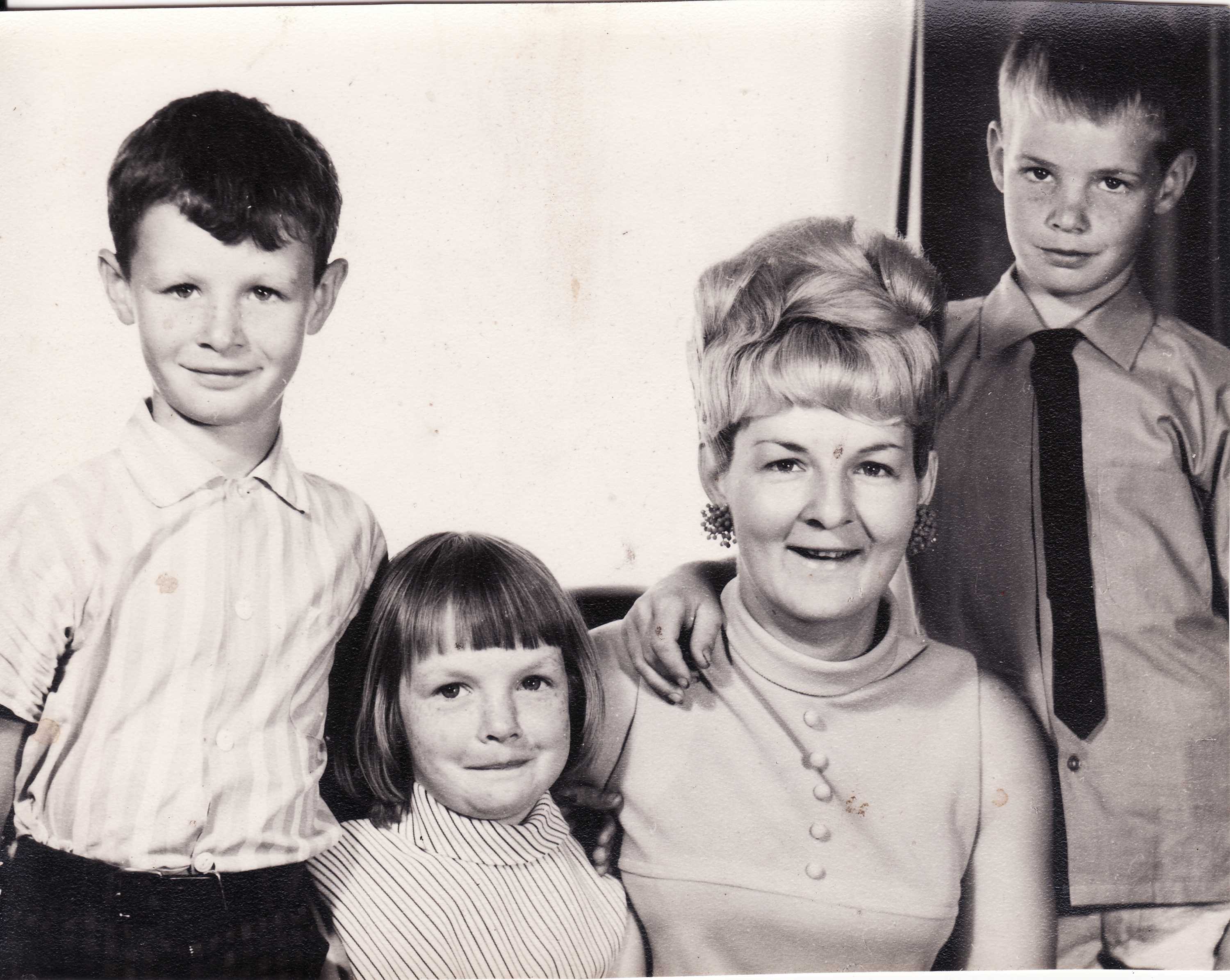 Black and white photo of Shirley and three kids in a portrait photo