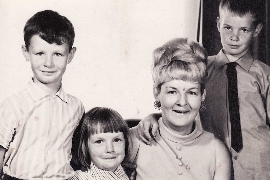 Black and white photo of Shirley and three kids in a portrait photo