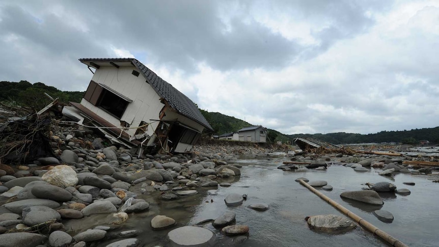 A collapsed house lies in the Hoshino River in Yame City, Fukuoka
