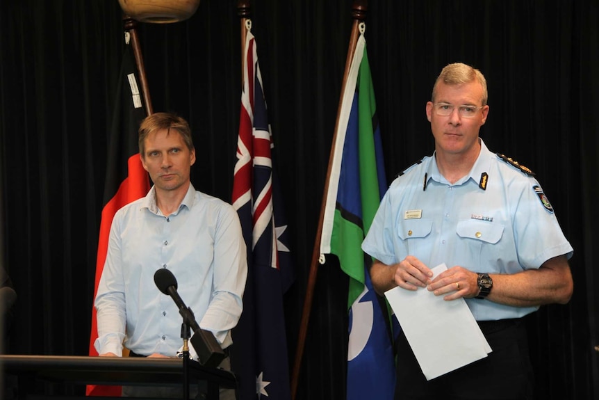 Two men speak during a press conference