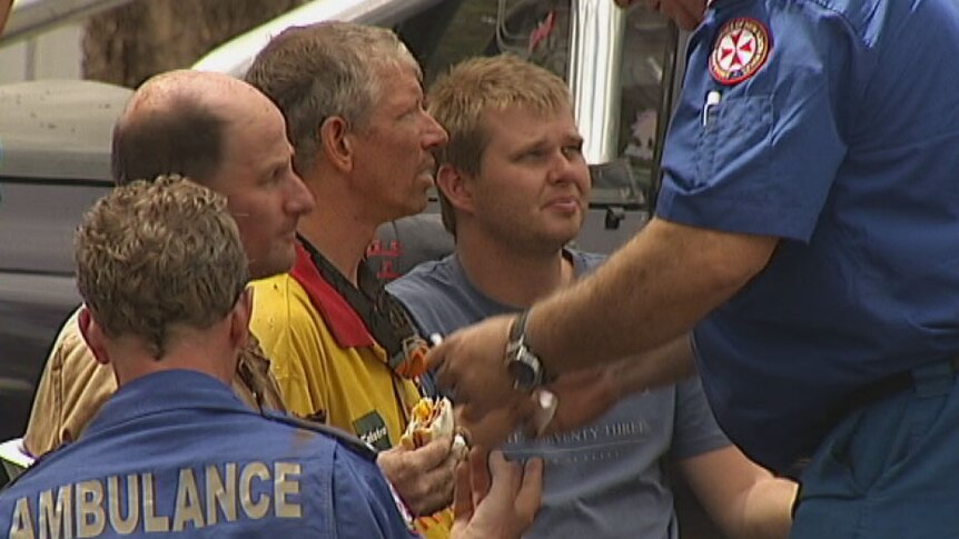 Ambulance officers found the three men were unharmed after being trapped underground.