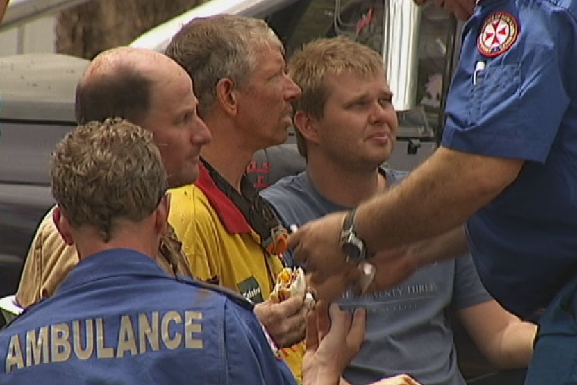Ambulance officers found the three men were unharmed after being trapped underground.