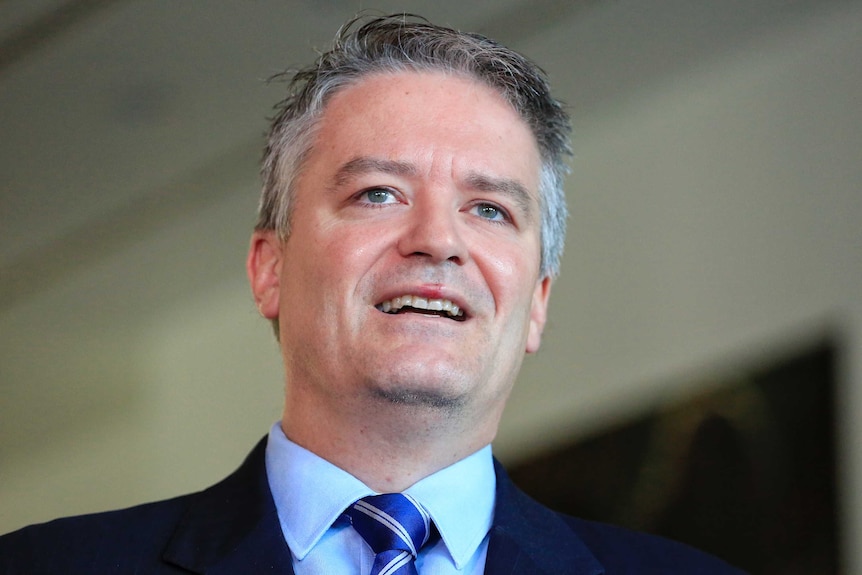 Senator Mathias Cormann speaks to reporters