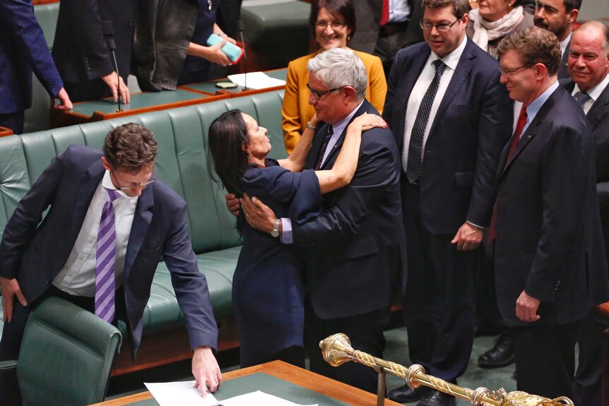 Linda Burney embraces Ken Wyatt, the first Indigenous male elected to the house of representatives.