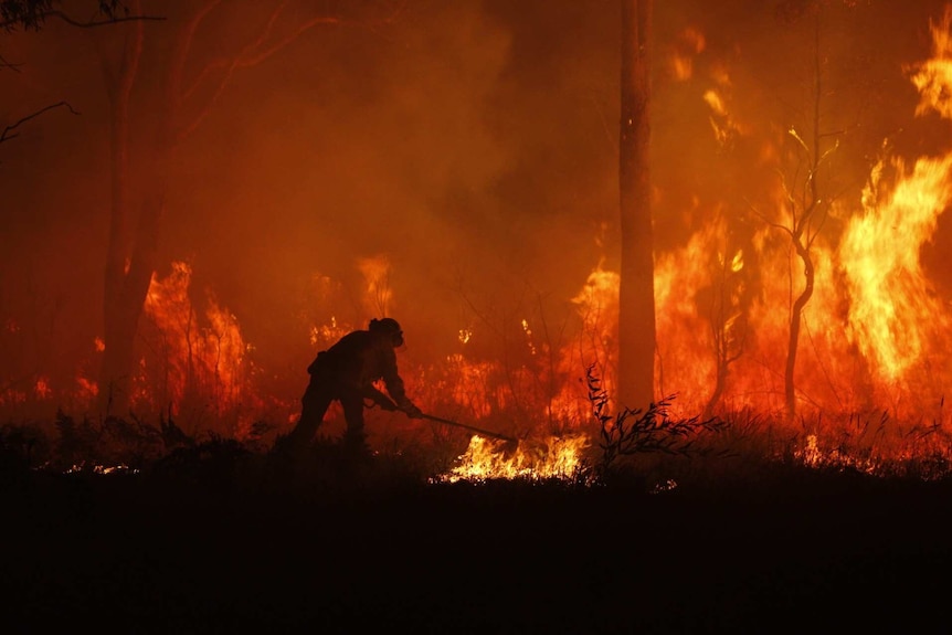 A firefighter battling a fire