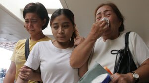 Indonesia: Distressed relatives wait for news on the missing airliner (file photo).