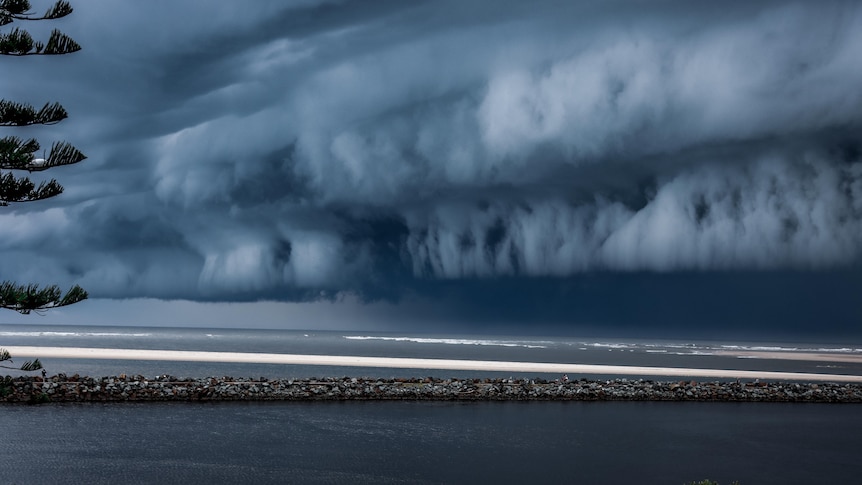 stormy sky above a breakwall