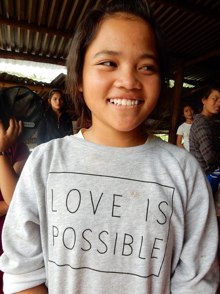 Orphans shirt says 'love is possible'