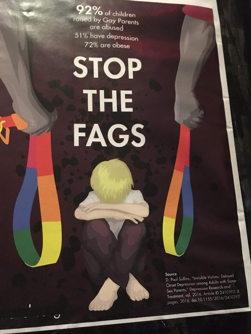A poster with the words "stop the fags" and two hands holding rainbow coloured belts over a cowering child.