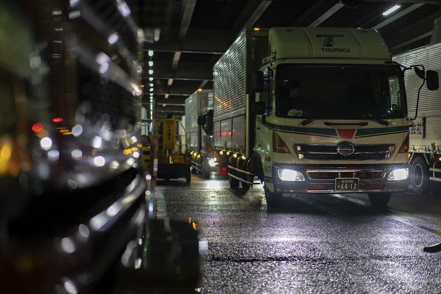 Trucks lined up making their final delivery to Tsukiji Market.