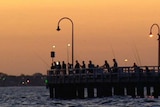 Fishermen at Port Melbourne trying to beat the heat.