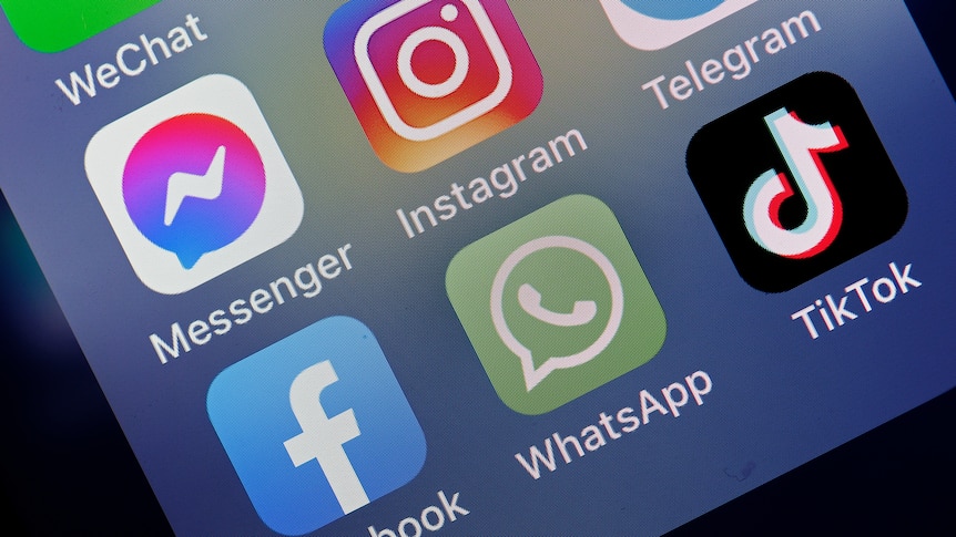 Messenger, Instagram, Facebook, WhatsApp and TikTok is displayed on the screen of an iPhone