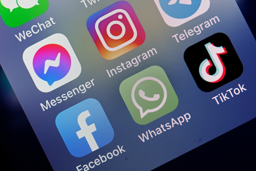 Messenger, Instagram, Facebook, WhatsApp and TikTok is displayed on the screen of an iPhone