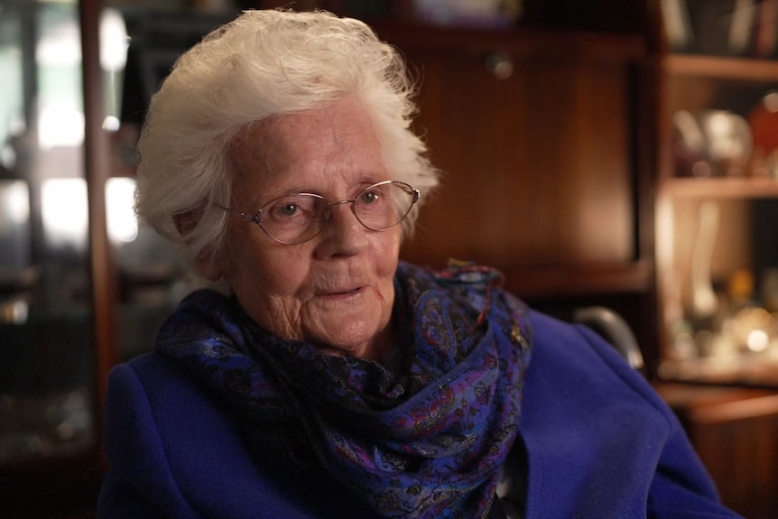 An elderly woman smiling