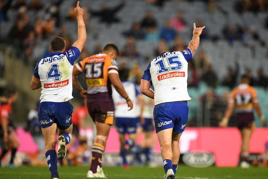 The Bulldogs celebrate Josh Morris' try during the round 21 NRL match against the Broncos in Sydney.