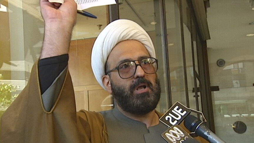 A file photo of Man Haron Monis talking to the media outside court.
