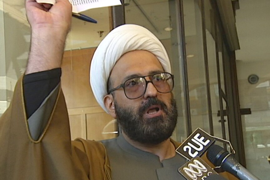A file photo of Man Haron Monis talking to the media outside court.