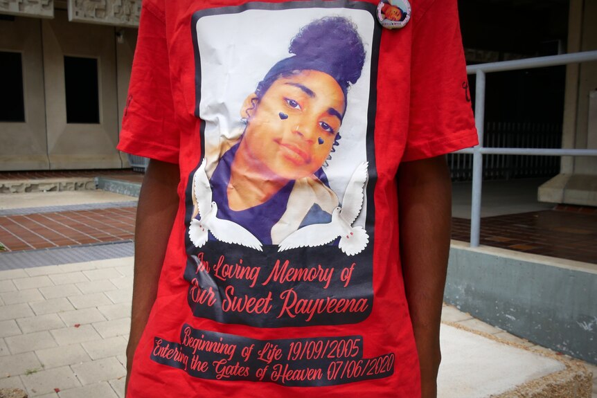 A red T-shirt with an image of a young woman and the words "In Loving Memory of Our Sweet Rayweena"