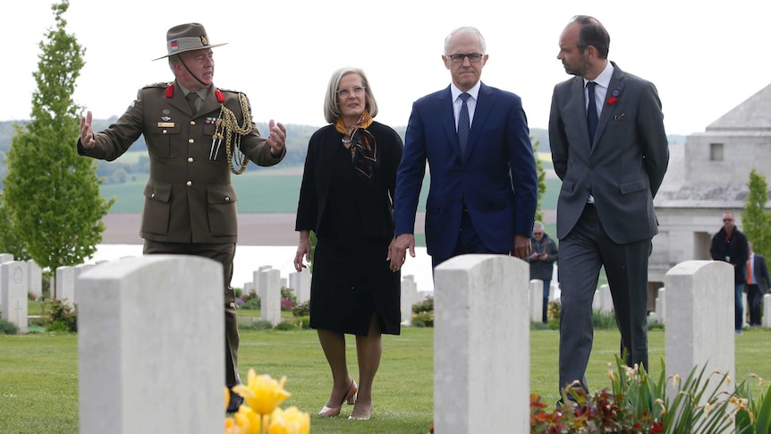 Australian Colonel Scott Clingan escorts Edouard Philippe, Malcolm Turnbull and Lucy Turnbull.