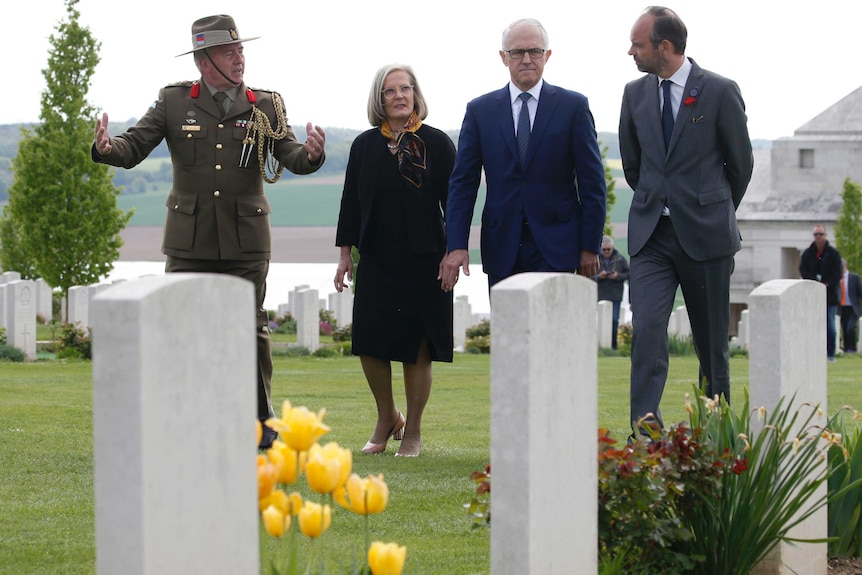 Australian Colonel Scott Clingan escorts Edouard Philippe, Malcolm Turnbull and Lucy Turnbull.