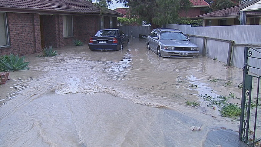 A burst main in Grand Junction Road flooded two houses at Valley View in Adelaide.