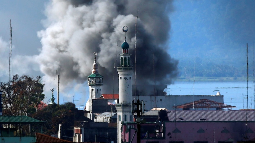 An explosion is seen after a Philippines army aircraft released a bomb during an airstrike.