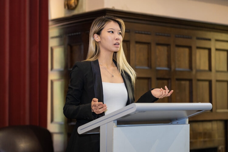 Emily Unity presenting and giving a speech