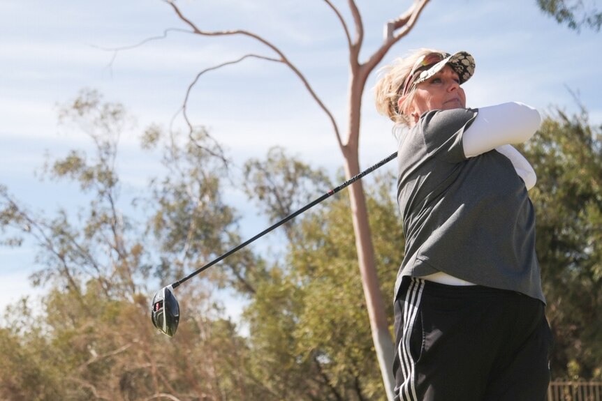 Alice Springs golfer Michelle Sawyer hits off on the first tee.