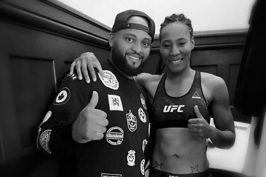 Zarah Fairn do Santos poses with her thumbs up posing with a friend in Melbourne.