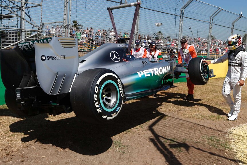 Mercedes driver Lewis Hamilton's car is towed away in first practice at the Melbourne Grand Prix.