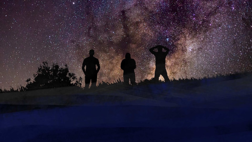 Three silhouetted people gaze out at a star filled sky.