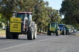 tractors drive along streets of mudgee in protest of mine