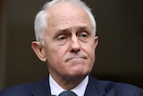 A close shot of Malcolm Turnbull looking not very happy at a press conference.