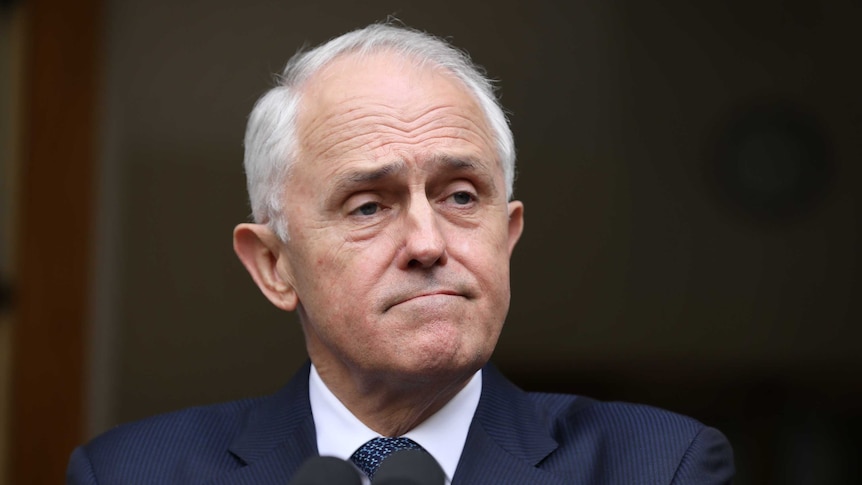 A close shot of Malcolm Turnbull looking not very happy at a press conference.