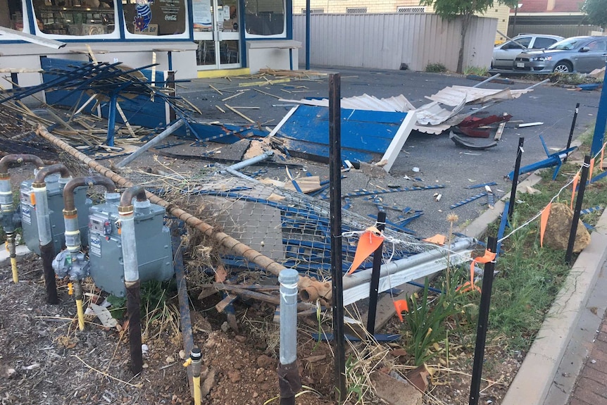 Debris scattered across a Barnacle Bill's shopfront