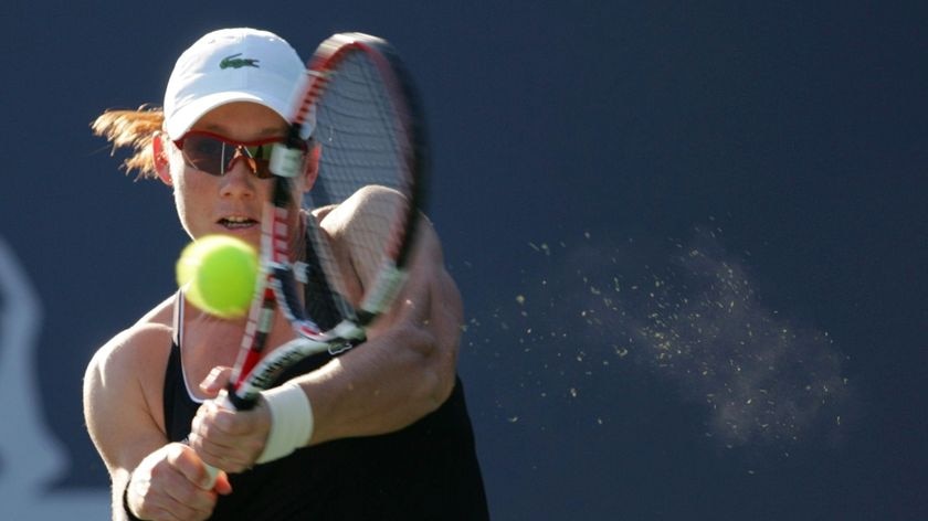 Stosur strikes a powerful backhand