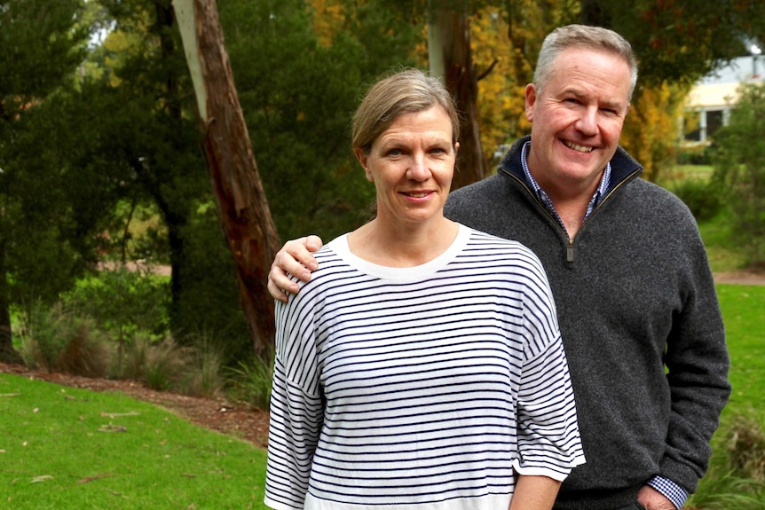 Tim Marwood and his wife Caroline Simmons pictured standing together in a garden