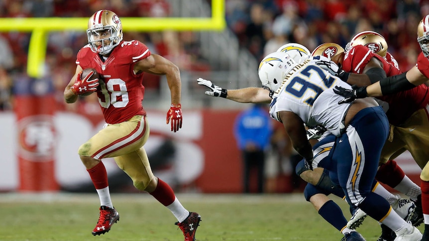 San Francisco 49ers' Jarryd Hayne runs with the ball against San Diego on September 3, 2015.