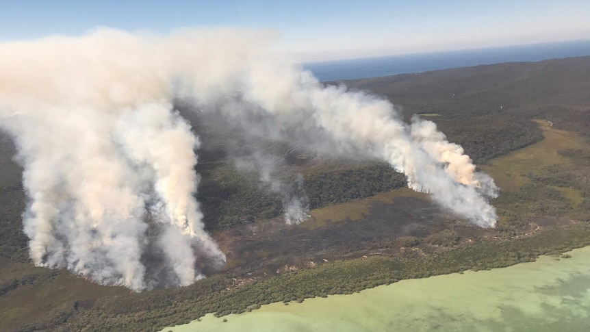 An aerial shot of the North Stradbroke Island bushfire, seen burning in peat and wetlands.
