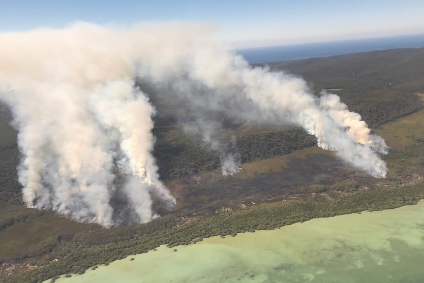 An aerial shot of the North Stradbroke Island bushfire, seen burning in peat and wetlands.